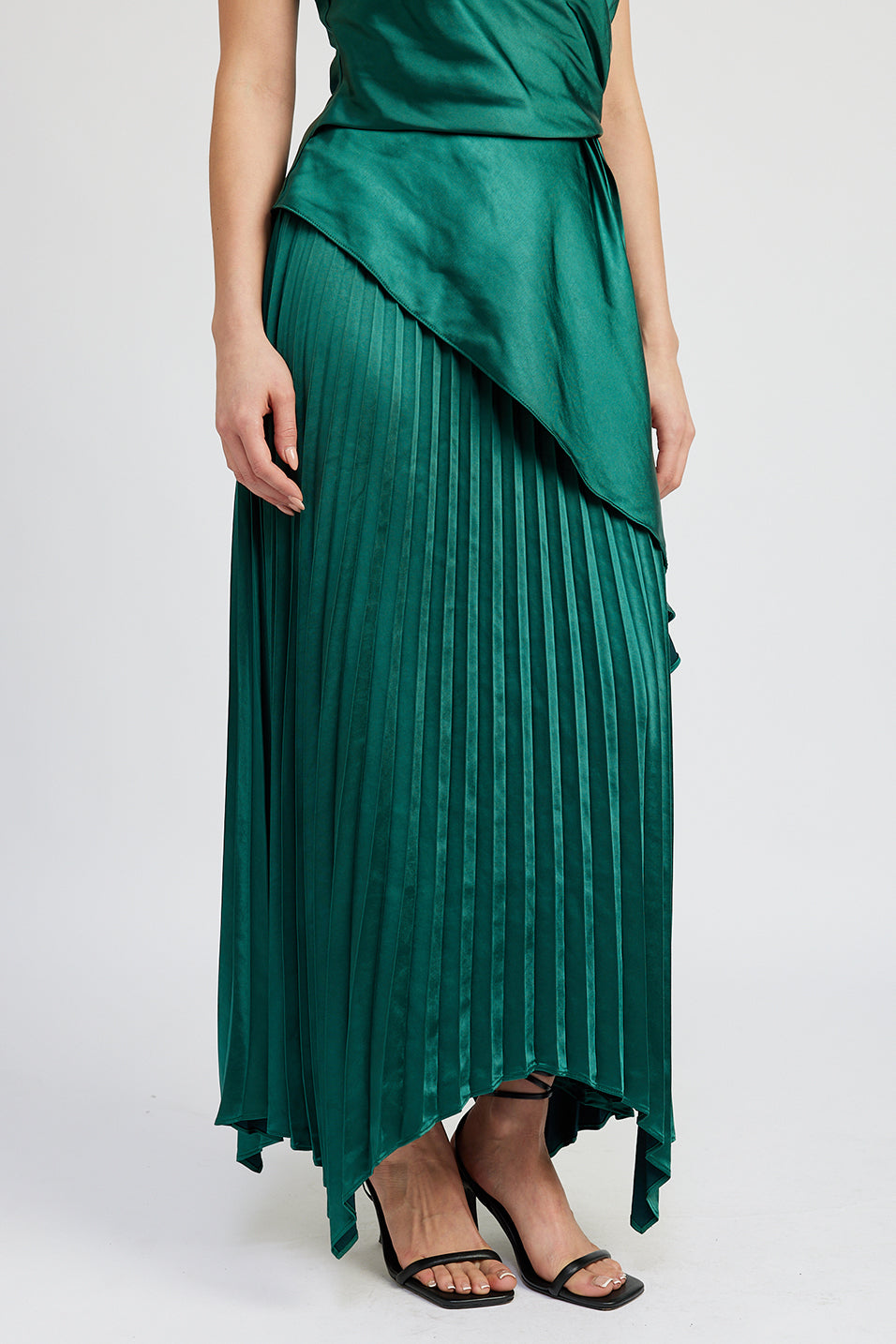 emerald green satin pleated midi skirt with asymetrical hem