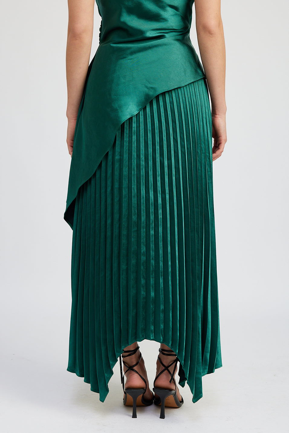 emerald green satin pleated midi skirt with asymetrical hem