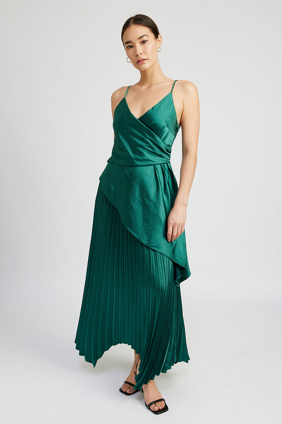 emerald green satin pleated midi skirt with asymetrical hem