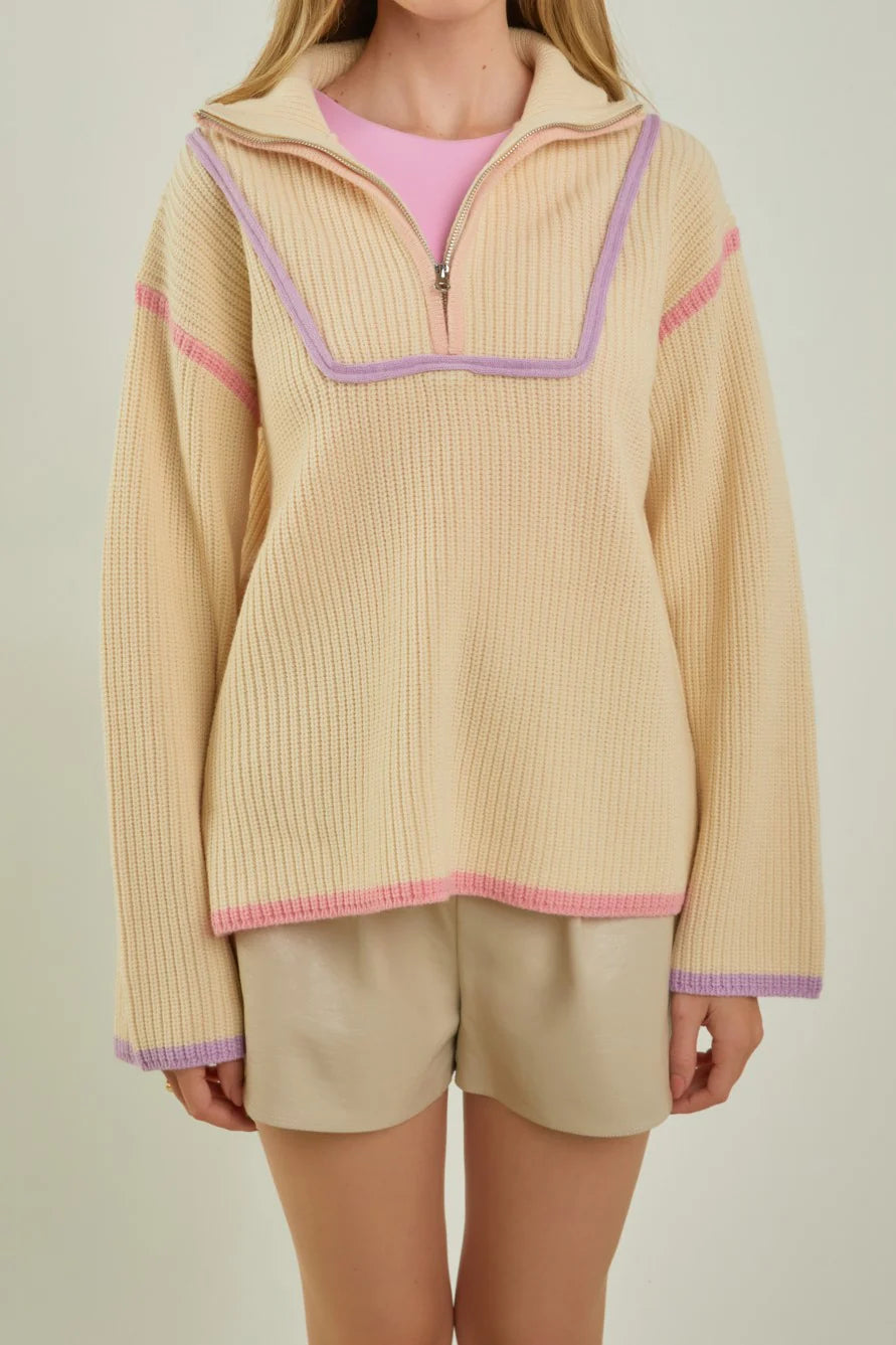 beige quarter zip pullover knit sweater with pink and purple piping