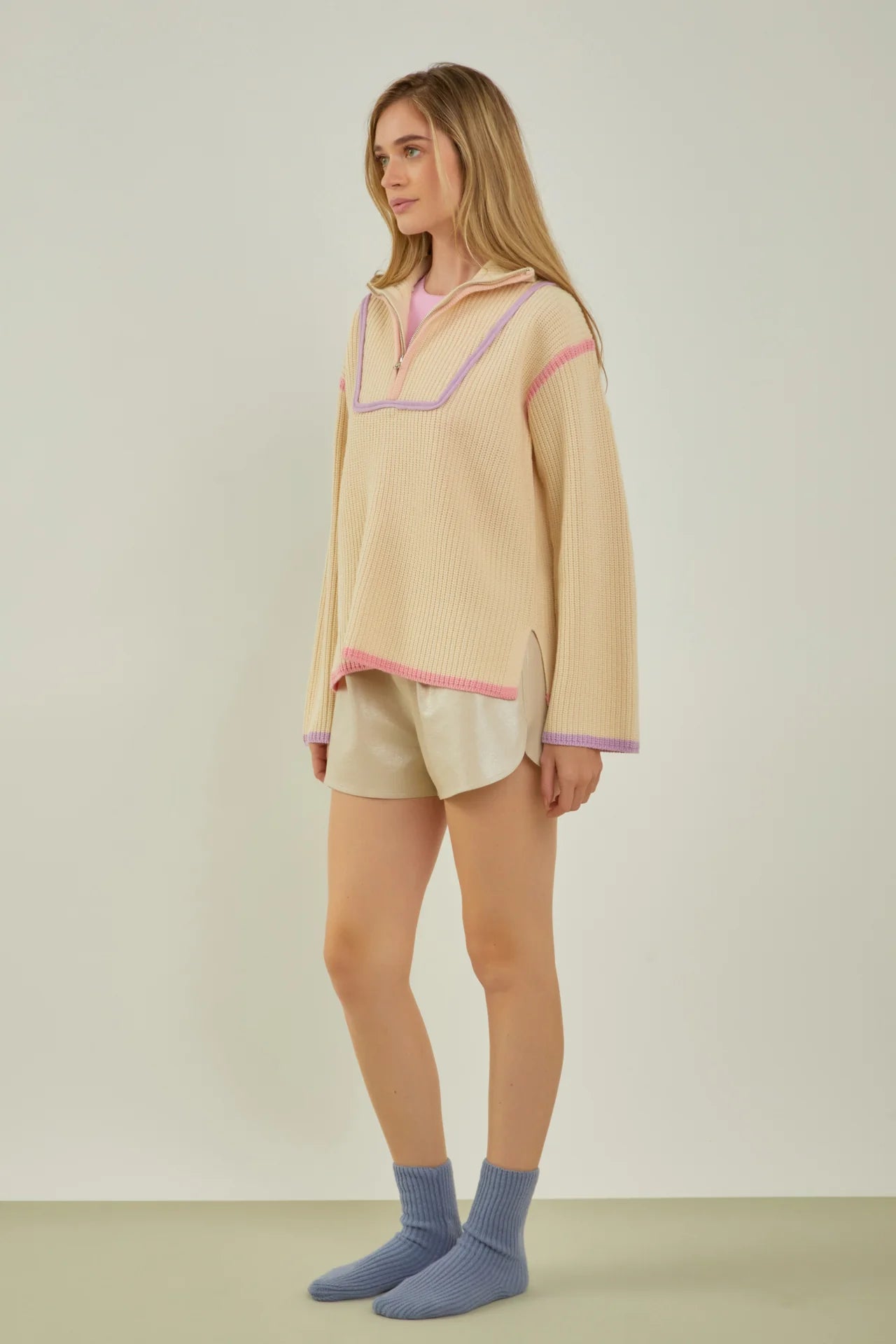 beige quarter zip pullover knit sweater with pink and purple piping