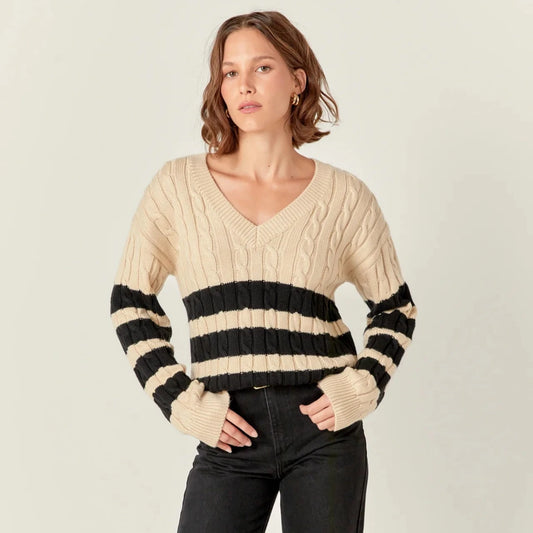 beige cable knit long sleeve sweater with vneck and black stripes