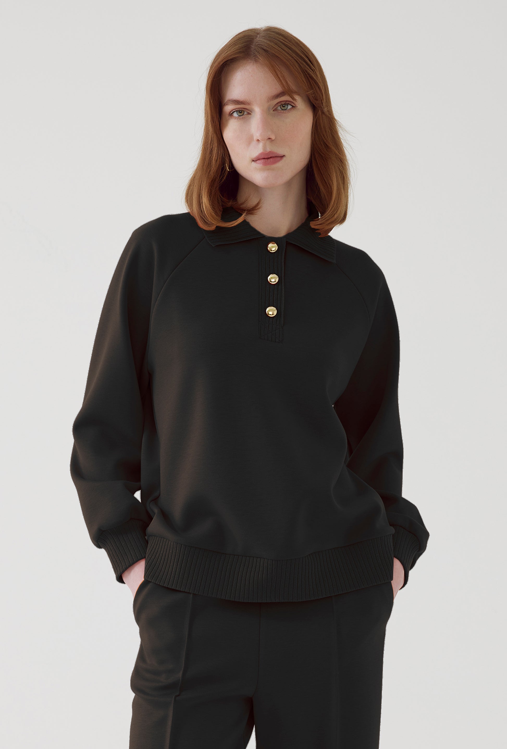 black pullover sweatshirt with gold buttons