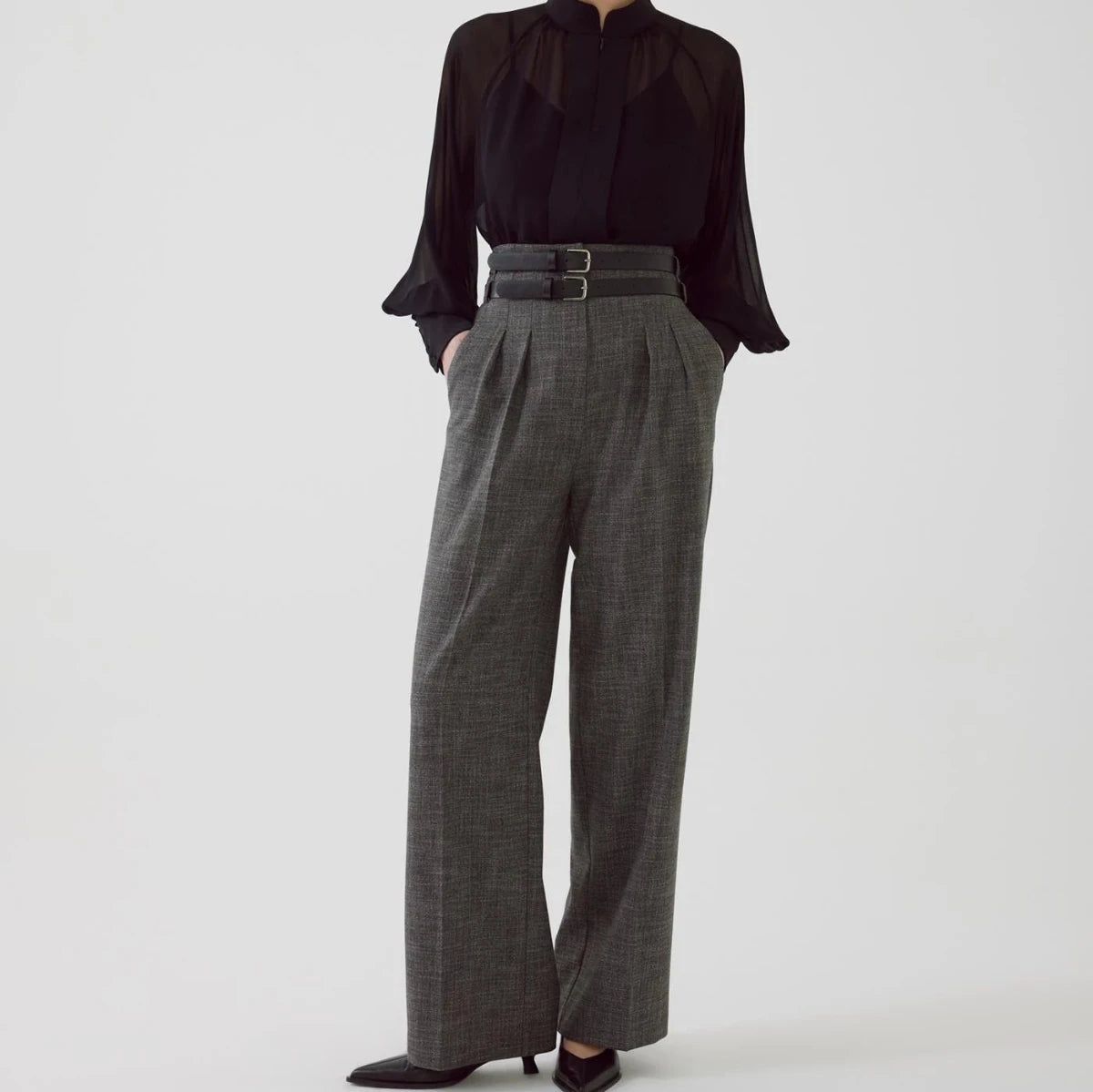 high waisted gray pleated slacks with double black belt