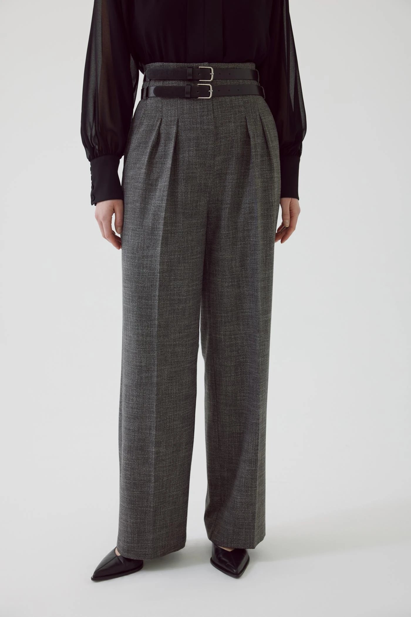 high waisted gray pleated slacks with double black belt