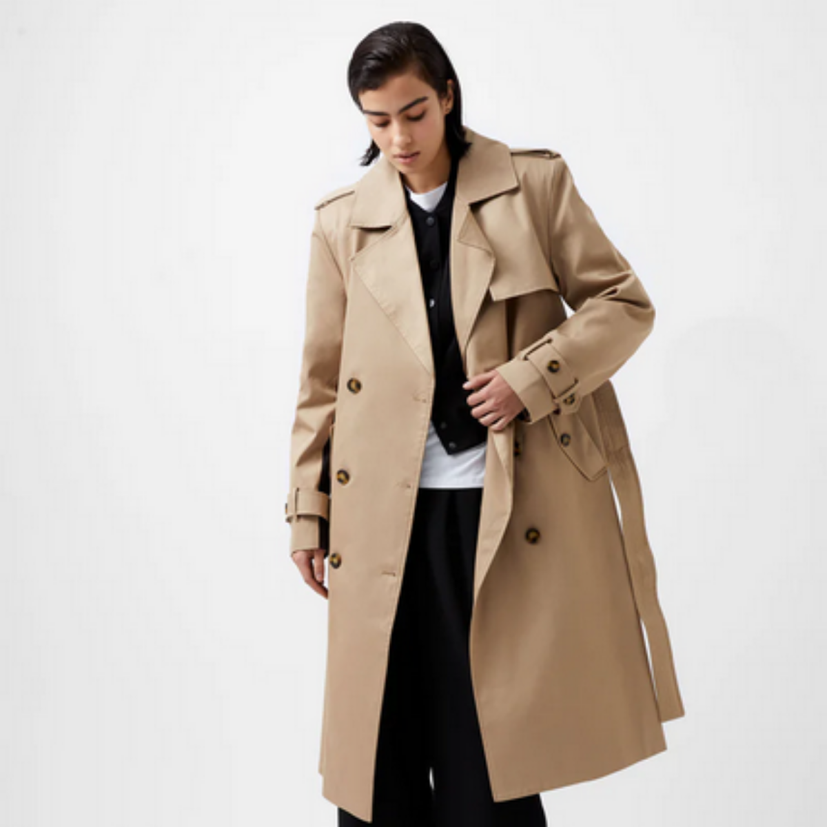 beige double-breasted trench coat with black stripe down the back