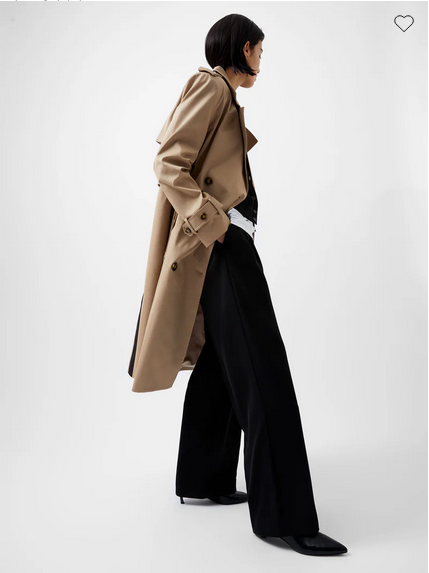 beige double-breasted trench coat with black stripe down the back