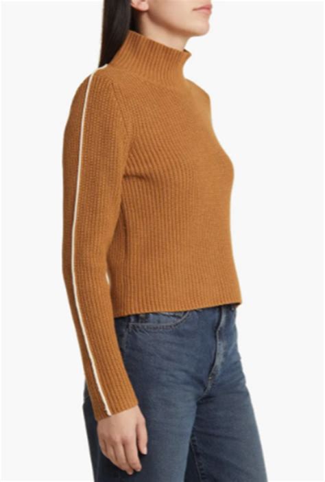 brown high mock neck knit sweater with ivory piping on the sleeves