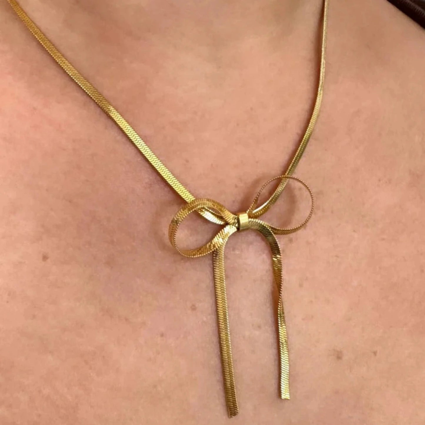 gold necklace with bow