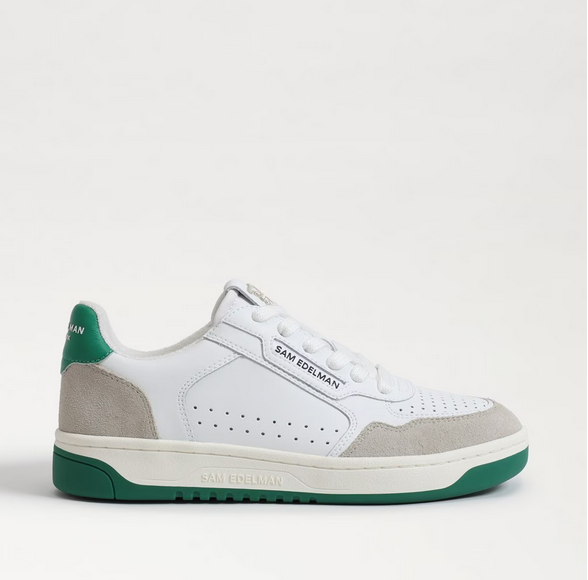 white sneakers with green soles and suede accents