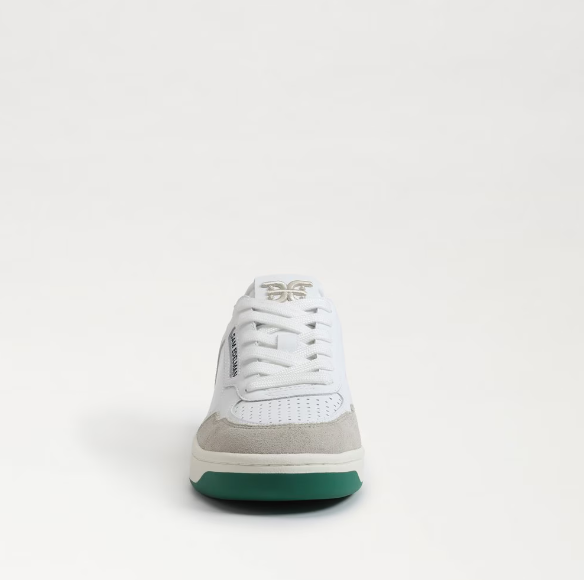 white sneakers with green soles and suede accents