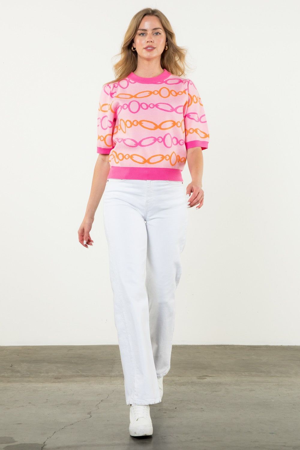 pink short sleeve sweater with pink and orange chain pattern